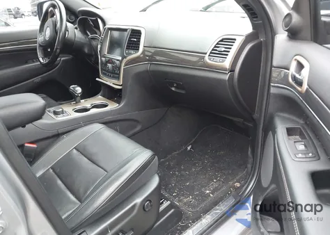 2014 Jeep Grand Cherokee Overland z USA, uszkodzony, nr VIN 1C4RJFCM5EC580597